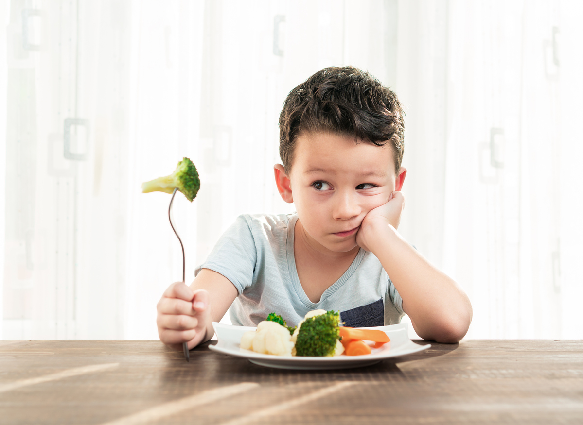 Child being a picky eater with veggies